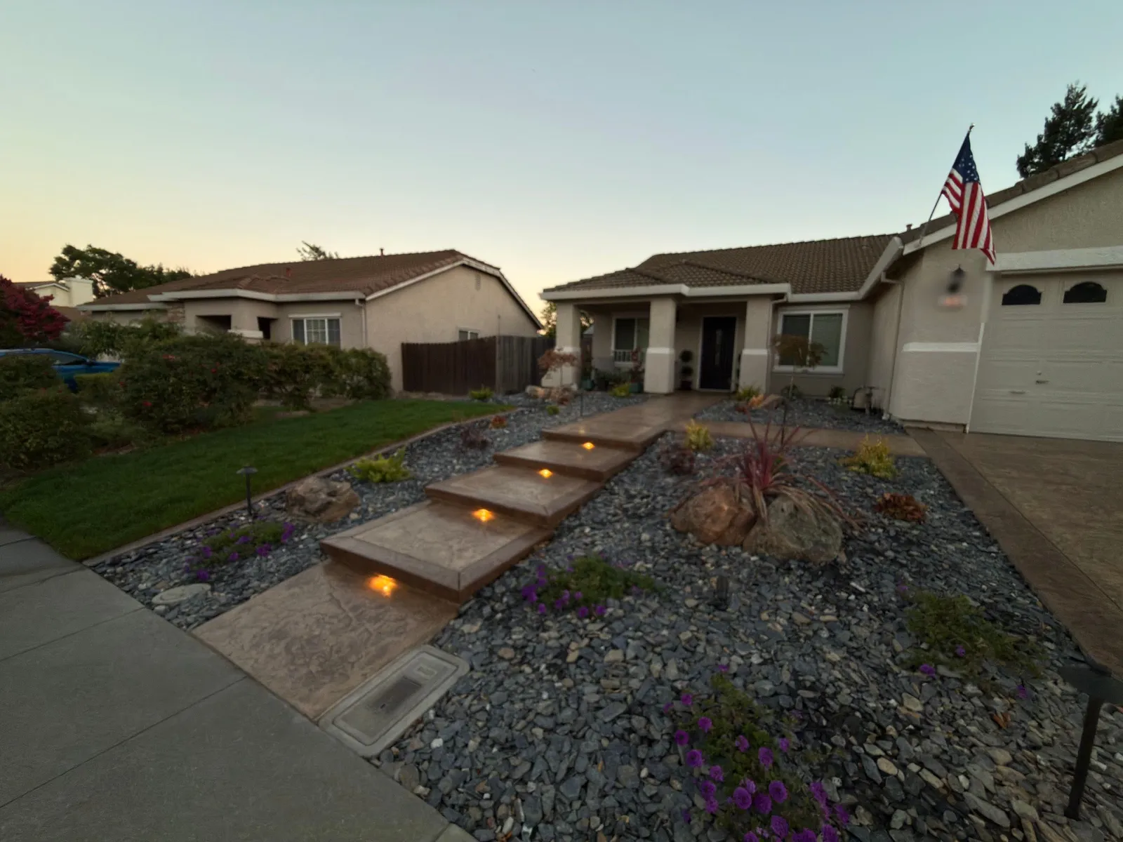 Front yard stamped concrete entrance with step lights in Vacaville, CA