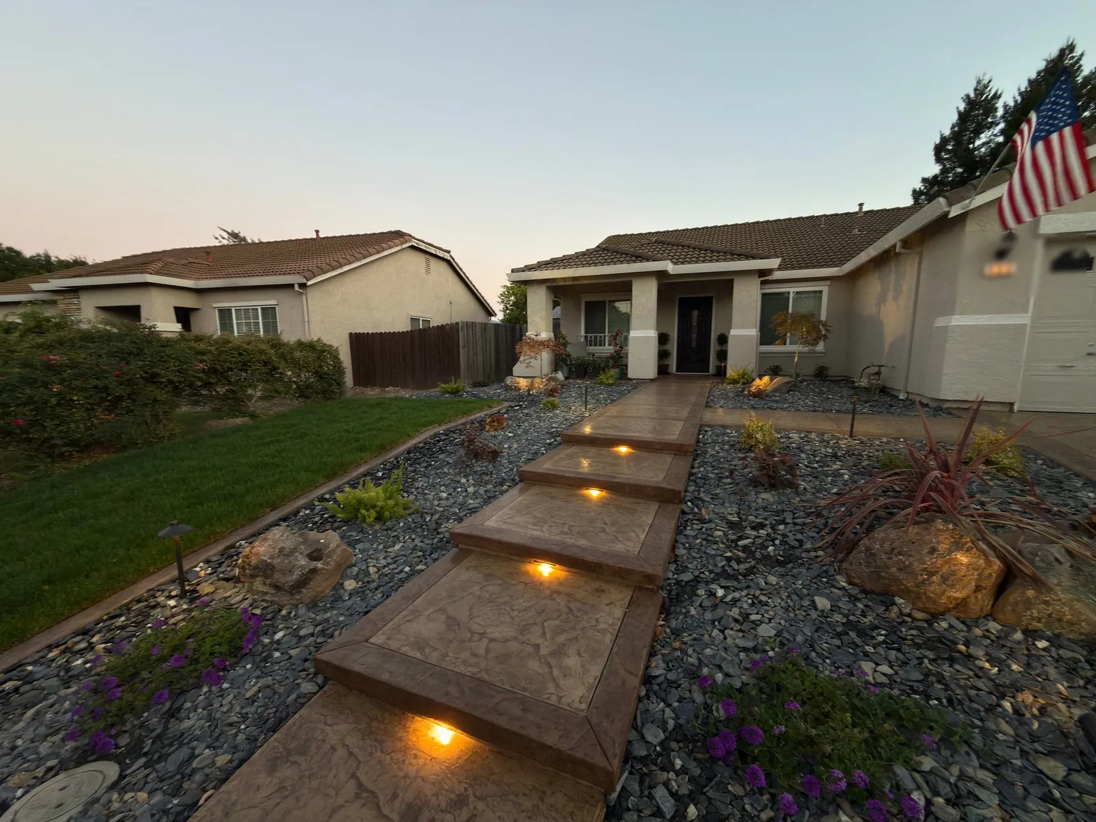 Stamped concrete front steps with lighting at dusk in Vacaville, CA