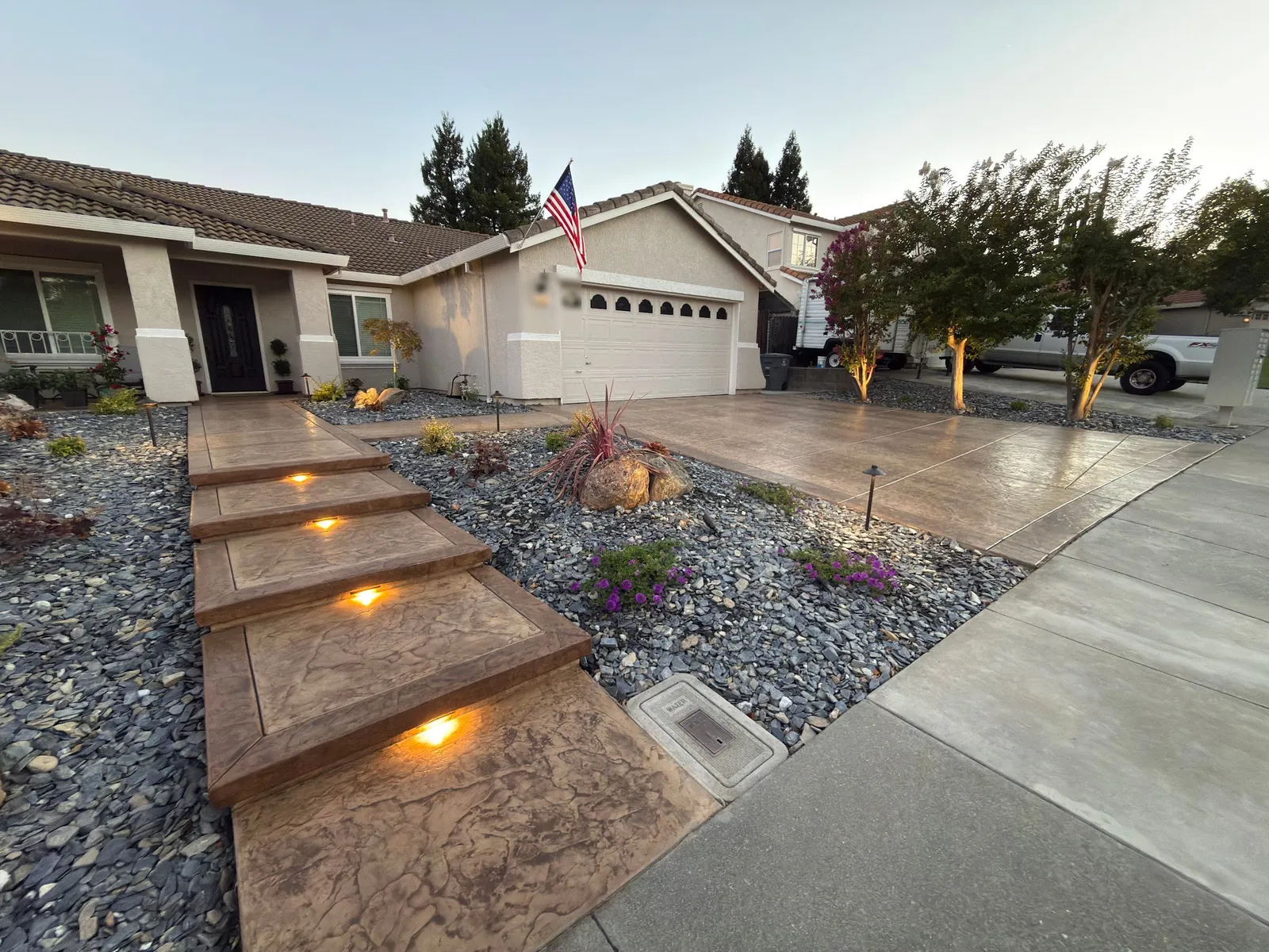Stamped concrete entry steps next to the driveway in Browns Valley