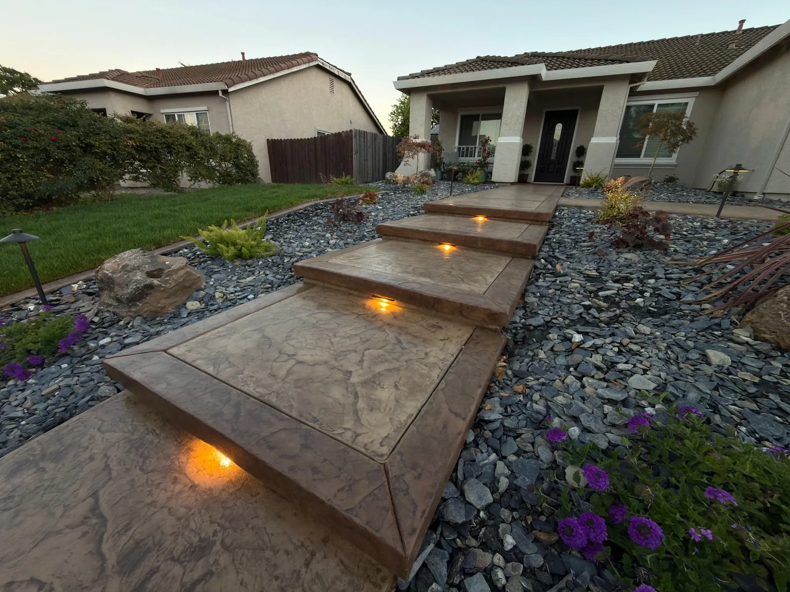 Two-tone stamped concrete steps with built-in step lights