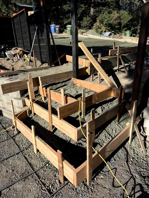 Wood forms and rebar set for new concrete steps on a Yountville project before the pour