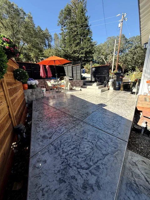 Stamped concrete walkway and patio along a side yard in Yountville